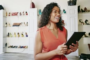 Mixed race woman working in shoe store