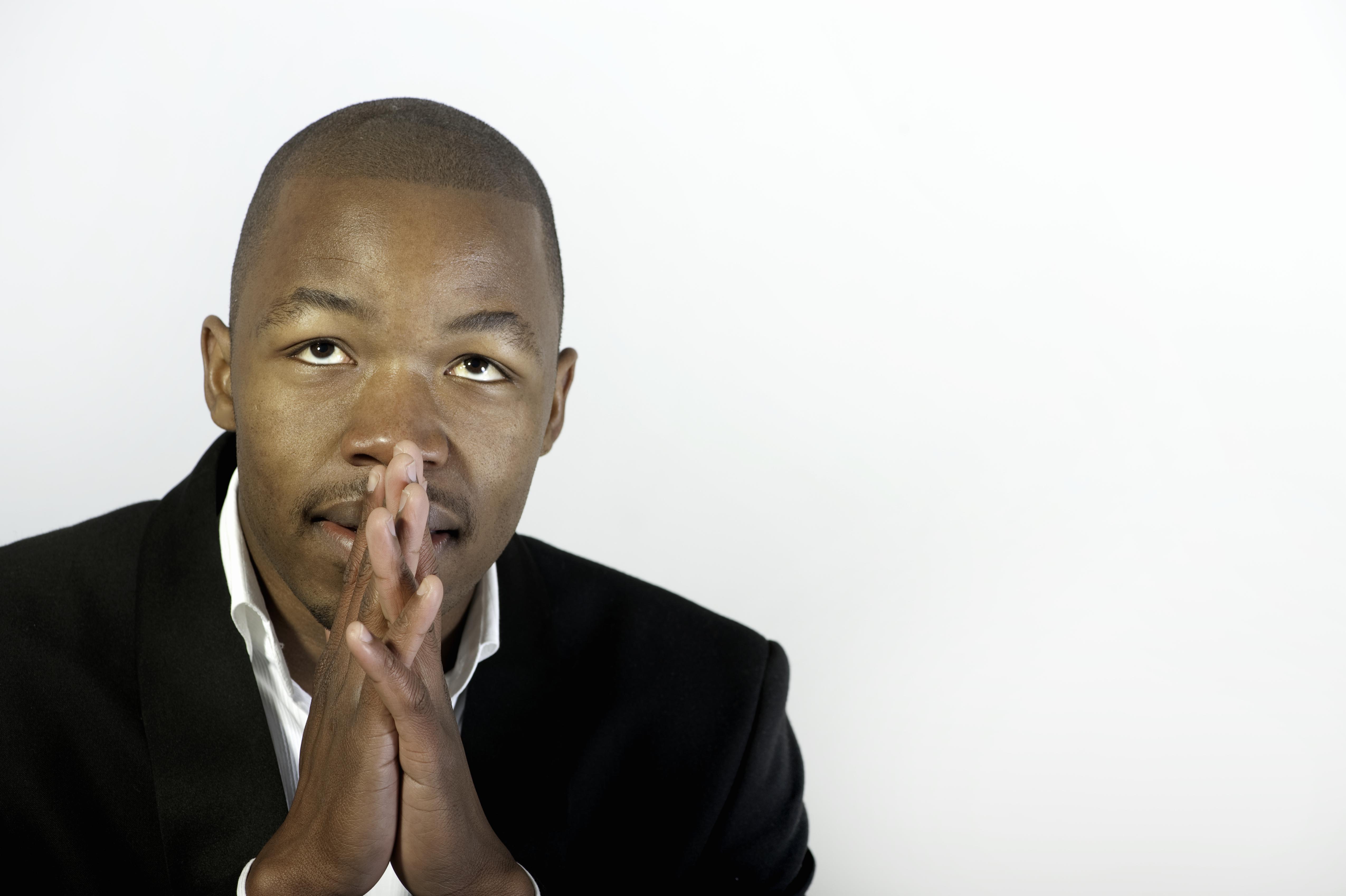 Close up portrait of a young man looking up, hopefully, Johannesburg, Gauteng Province, South Africa