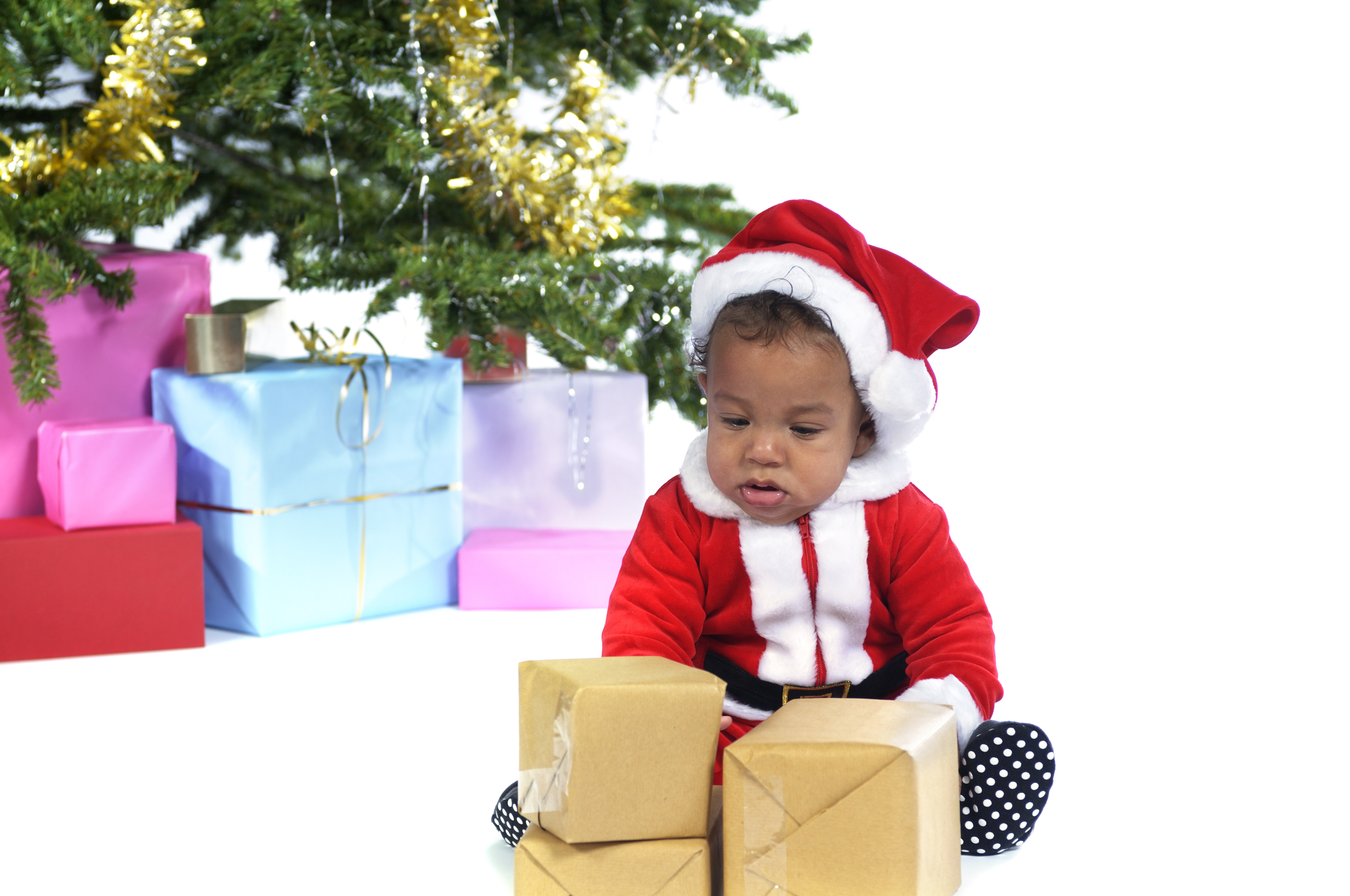 Baby Santa Looking at his Presents